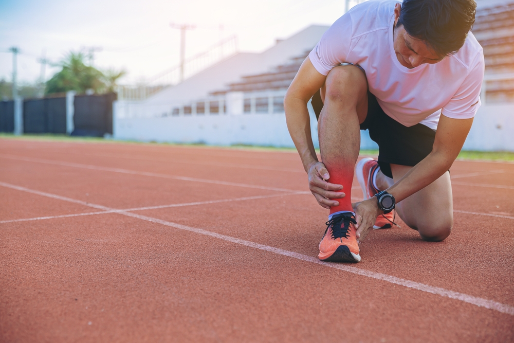 A,Man,Runner,Has,Twisted,Ankle,Injury,While,Practice,Marathon