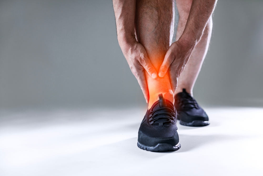 Athlete,Man,Experiencing,Sudden,Pain,In,Ankle,During,Sporting,Activity.